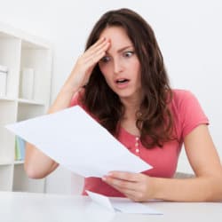 Lady looking sad because her home has a judgement against it